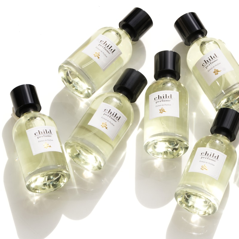 Multiple bottles shown top view of Child Perfume Limited Edition Extrait de Parfum Spray 50 ml