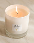 Child Perfume Scented Candle (8 oz) shown lit